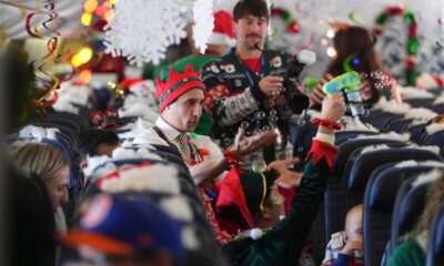 flight-takes-kids-to-visit-santa-at-north-pole-scene-in-transformed-denver-airport-hangar