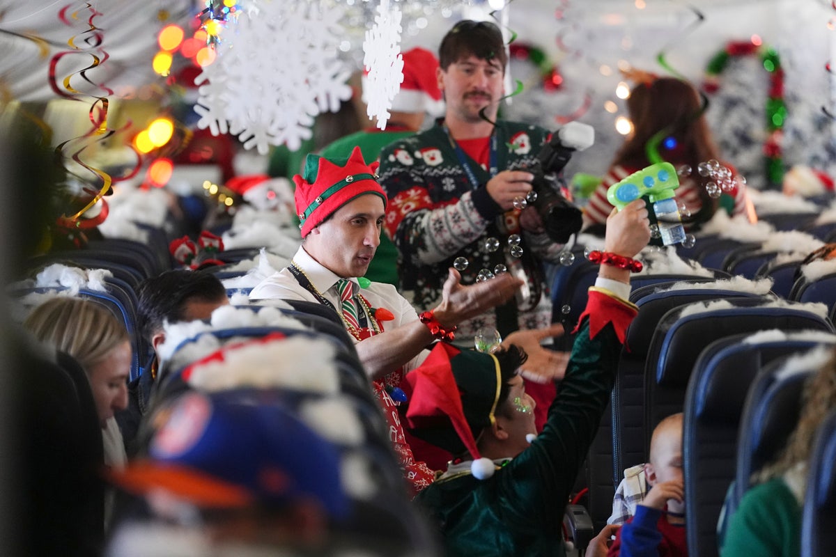 flight-takes-kids-to-visit-santa-at-north-pole-scene-in-transformed-denver-airport-hangar