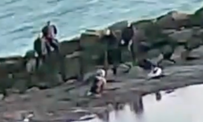 mother-and-daughter-trapped-in-sand-on-beach-saved-by-theme-park-team