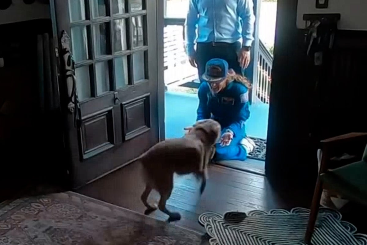 adorable-moment-artemis-ii-astronaut-is-welcomed-home-by-her-dog